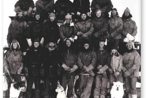 SANAE 16  (1975): Back (L-R) Gert Meyer, Ken Cleland, Rob Heard, Sandor Rozsnyai, John Rash; Middle: Wolfgang Deckler, Stephan Bothma, Mike Perks, Tino Rupping, Donald King, Desmond Duthie, Gert Ochse, Carel Brand; Front: Padraig Culligan, Graham Meineke, Godfrey Knight, Evan Morkel (Leader), Richard Otto, Gerhard Barnardo, Heinz Kramer, Stewart Lund; Dogs: Ringo, Frosty, Kerneels.